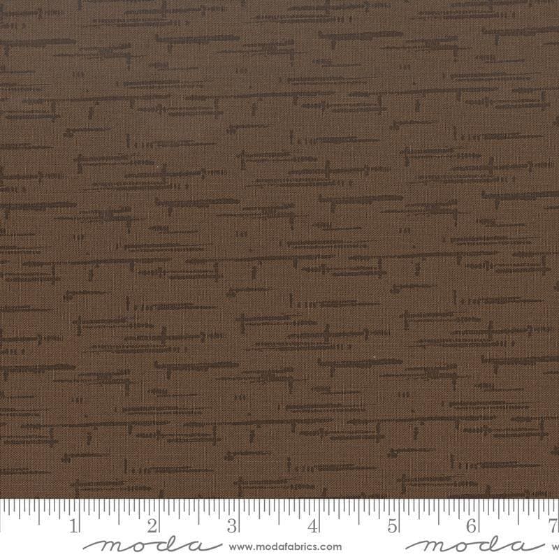 Image of Windfall Texture Blender Coffee quilting cotton fabric by Fancy That Design House for Moda Fabric. Features printed texture on a brown background. Cute Little Fabric Shop.