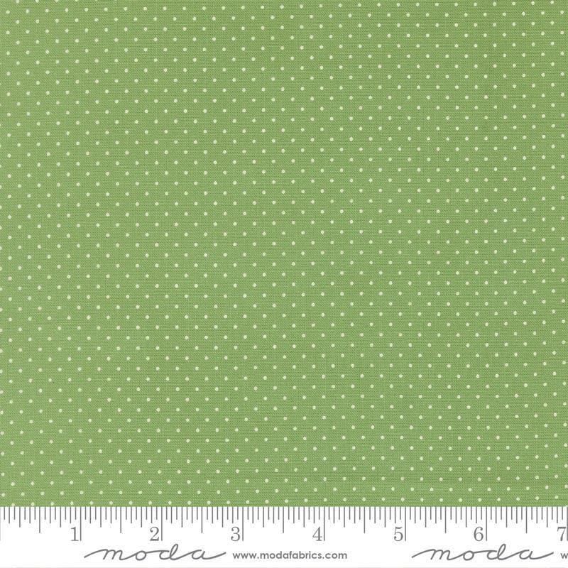 Image of Merrily on High Festive Dot Evergreen quilting cotton fabric by Sweetfire Road for Moda Fabrics. Features polka dots on a green background. Cute Little Fabric Shop.