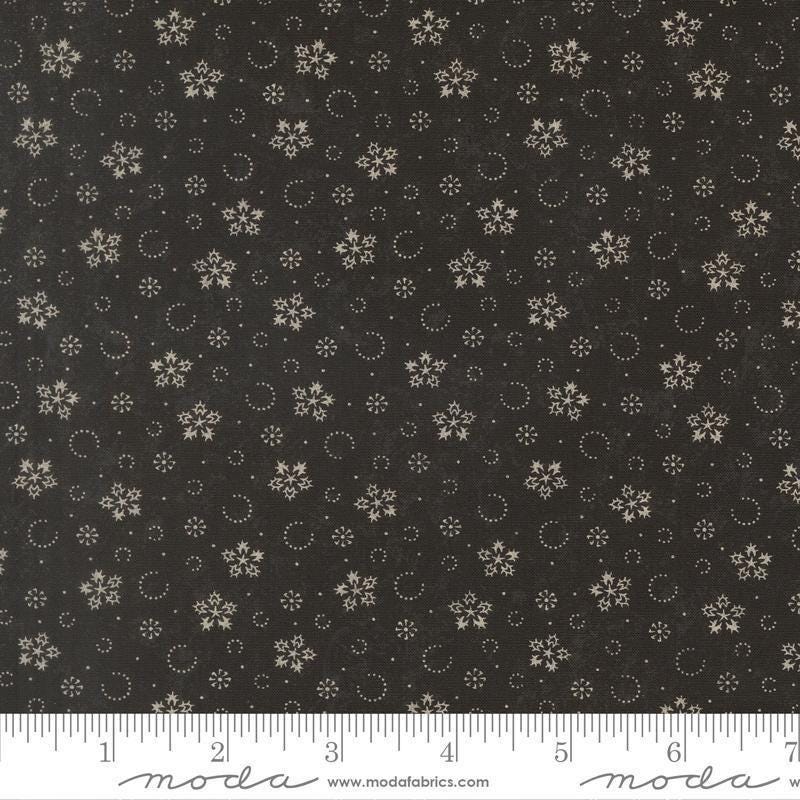 Image of Candlelight Christmas Festive Flurries Ebony quilting cotton fabric by 3 Sisters for Moda Fabrics. Features snowflakes on a black background. Cute Little Fabric Shop.