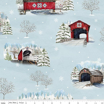 Image of Covered Bridges in Winter Main Iceberg quilting cotton fabric by Tara Reed for Riley Blake Designs. Features trees on a blue background. Cute Little Fabric Shop.