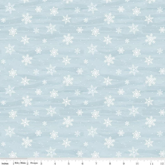 Image of Covered Bridges in Winter Snowflakes Iceberg quilting cotton fabric by Tara Reed for Riley Blake Designs. Features snowflakes on a blue background. Cute Little Fabric Shop.