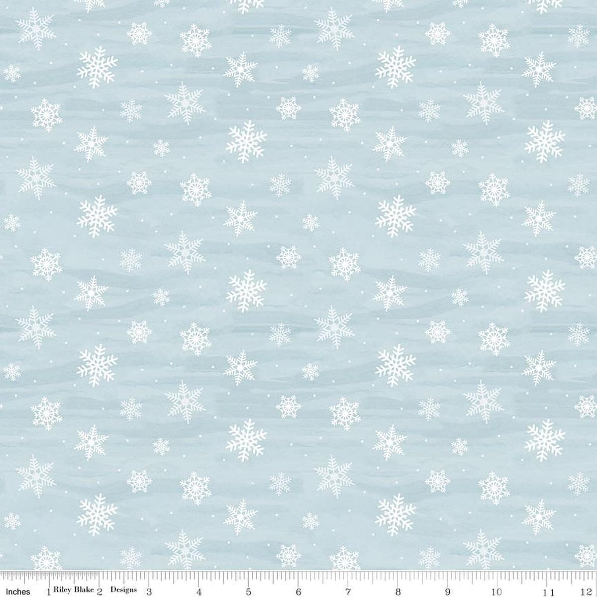 Image of Covered Bridges in Winter Snowflakes Iceberg quilting cotton fabric by Tara Reed for Riley Blake Designs. Features snowflakes on a blue background. Cute Little Fabric Shop.