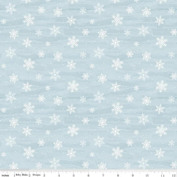 Image of Covered Bridges in Winter Snowflakes Iceberg quilting cotton fabric by Tara Reed for Riley Blake Designs. Features snowflakes on a blue background. Cute Little Fabric Shop.
