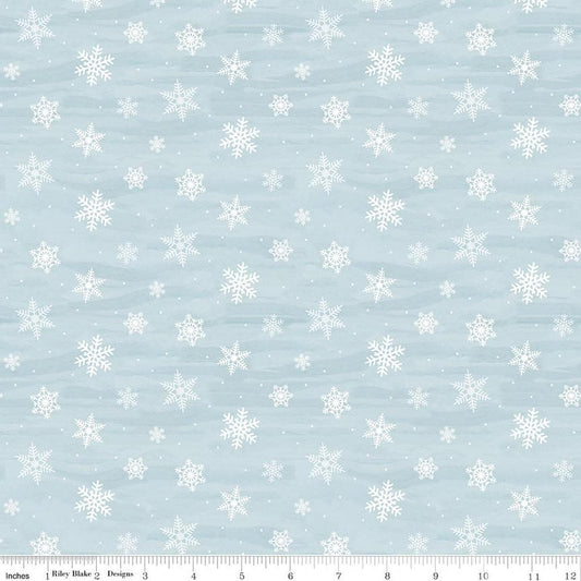 Image of Covered Bridges in Winter Snowflakes Iceberg quilting cotton fabric by Tara Reed for Riley Blake Designs. Features snowflakes on a blue background. Cute Little Fabric Shop.