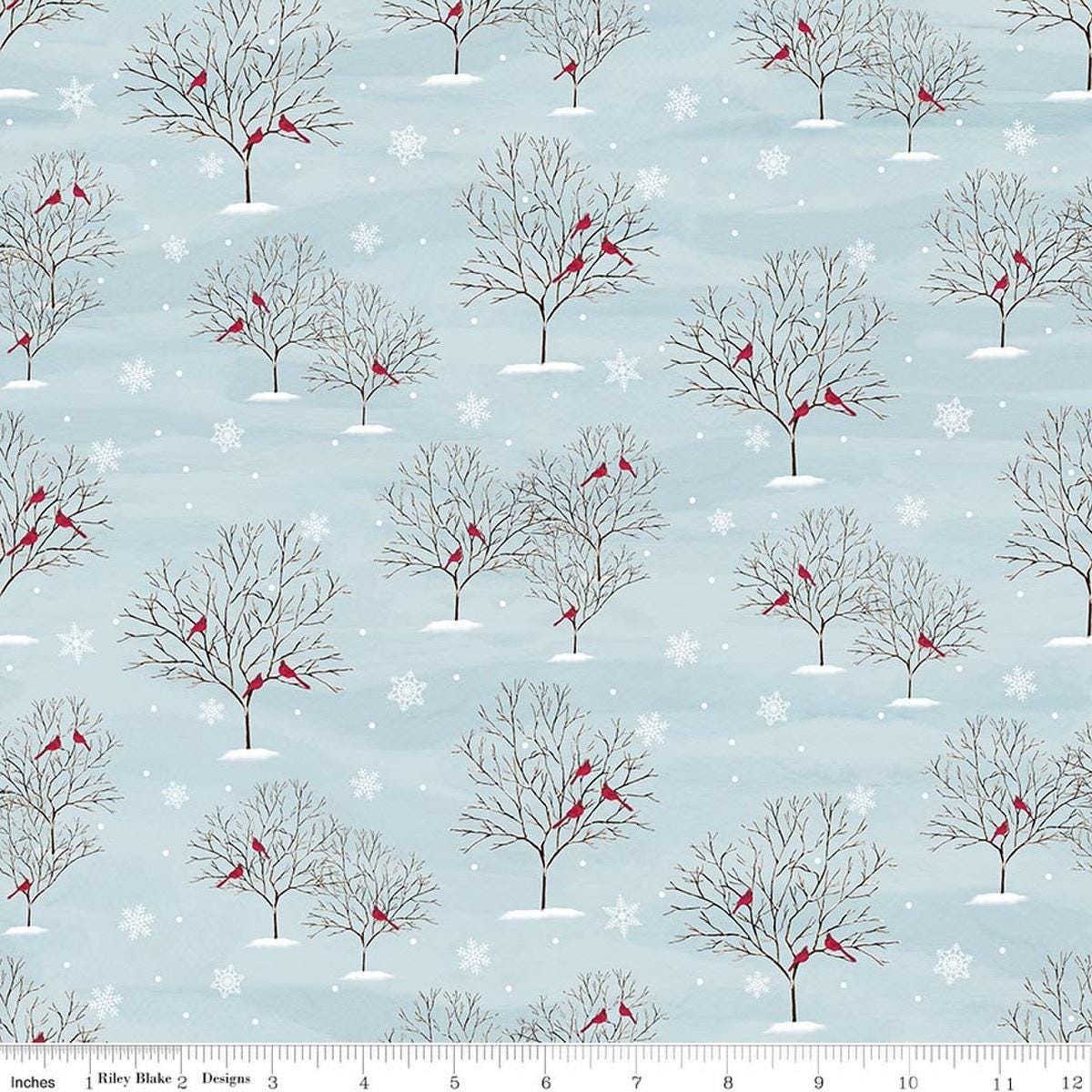 Image of Covered Bridges in Winter Trees Iceberg quilting cotton fabric by Tara Reed for Riley Blake Designs. Features trees on a blue background. Cute Little Fabric Shop.