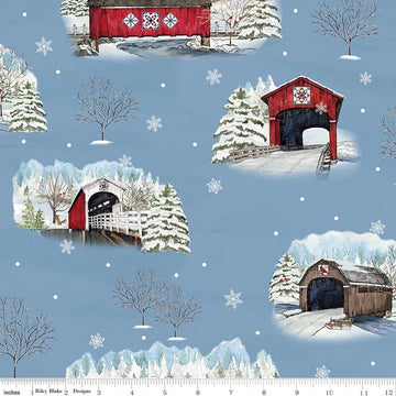 Image of Covered Bridges in Winter Main Blue quilting cotton fabric by Tara Reed for Riley Blake Designs. Features trees on a blue background. Cute Little Fabric Shop.