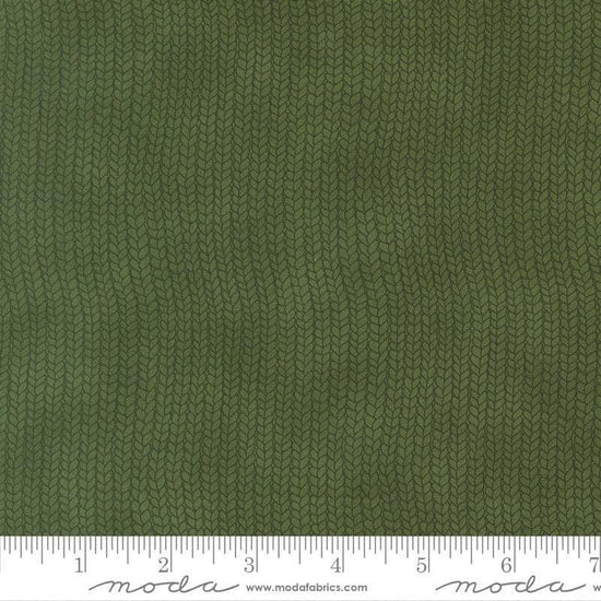 Image of When Snow Falls Stocking Weave Holly quilting cotton fabric by Deb Strain for Moda Fabrics. Features printed tonal knitting texture on a green background. Cute Little Fabric Shop.