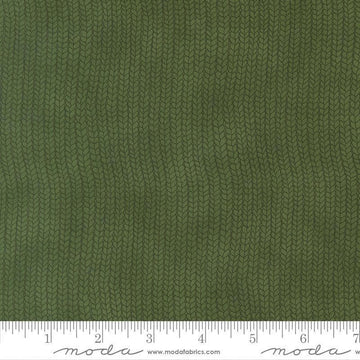 Image of When Snow Falls Stocking Weave Holly quilting cotton fabric by Deb Strain for Moda Fabrics. Features printed tonal knitting texture on a green background. Cute Little Fabric Shop.