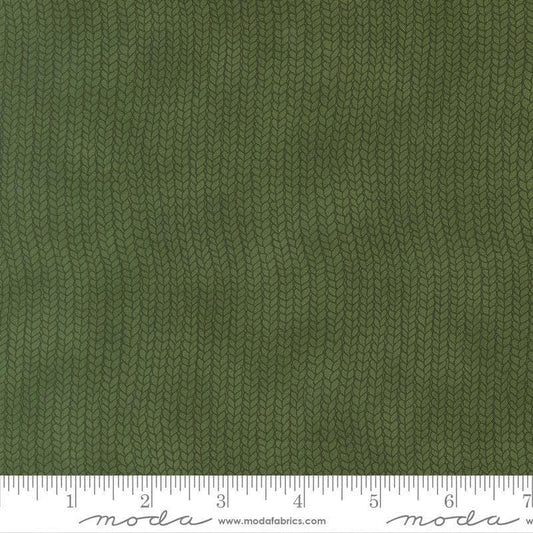 Image of When Snow Falls Stocking Weave Holly quilting cotton fabric by Deb Strain for Moda Fabrics. Features printed tonal knitting texture on a green background. Cute Little Fabric Shop.