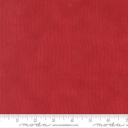 Image of When Snow Falls Stocking Weave Berry Red quilting cotton fabric by Deb Strain for Moda Fabrics. Features printed tonal knitting texture on a red background. Cute Little Fabric Shop.