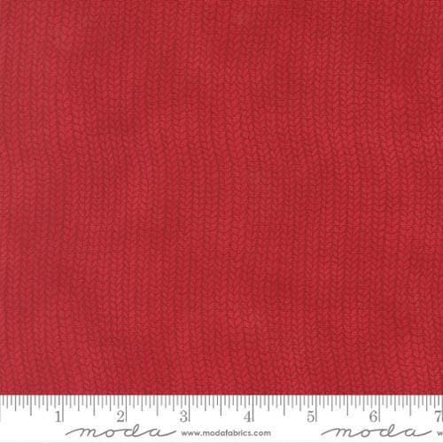 Image of When Snow Falls Stocking Weave Berry Red quilting cotton fabric by Deb Strain for Moda Fabrics. Features printed tonal knitting texture on a red background. Cute Little Fabric Shop.