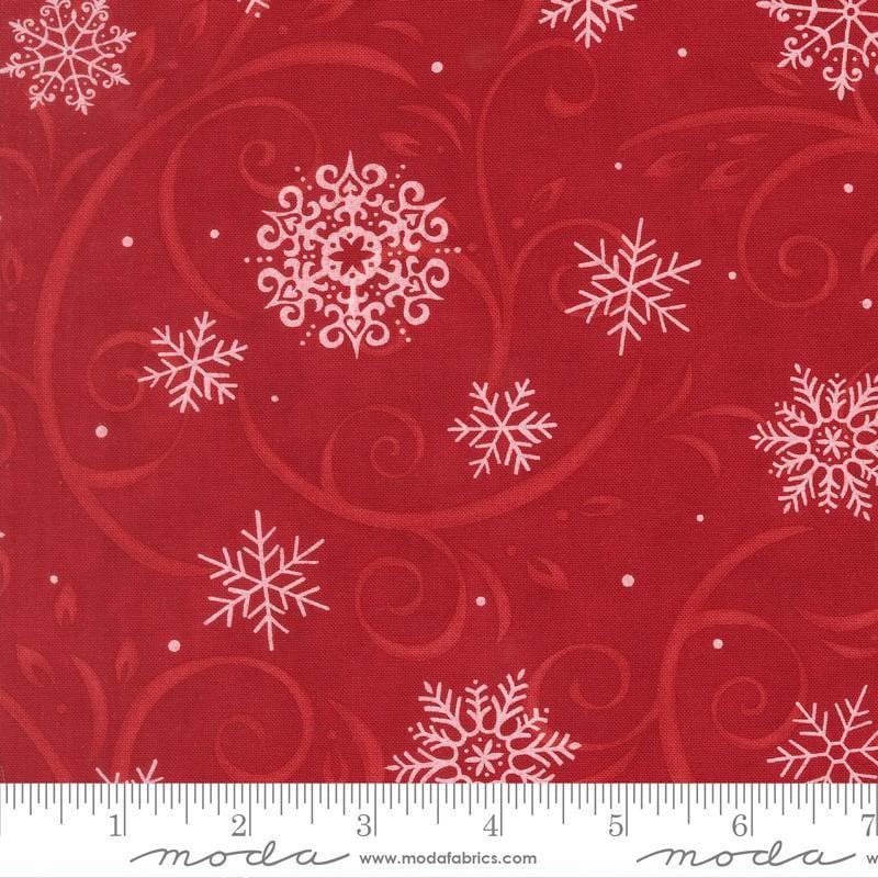 Image of When Snow Falls Swirling Snowflakes Berry Red quilting cotton fabric by Deb Strain for Moda Fabrics. Features snowflakes and swirls on a red background. Cute Little Fabric Shop.