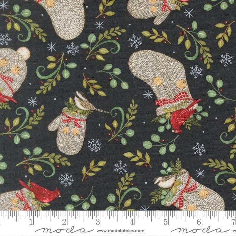 Image of When Snow Falls Winter Wear Night Sky quilting cotton fabric by Deb Strain for Moda Fabrics. Features stockings, mittens, and leaves on a blue background. Cute Little Fabric Shop.