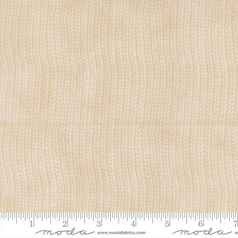 Image of When Snow Falls Stocking Weave Snowy White quilting cotton fabric by Deb Strain for Moda Fabrics. Features printed tonal knitting texture on a cream background. Cute Little Fabric Shop.