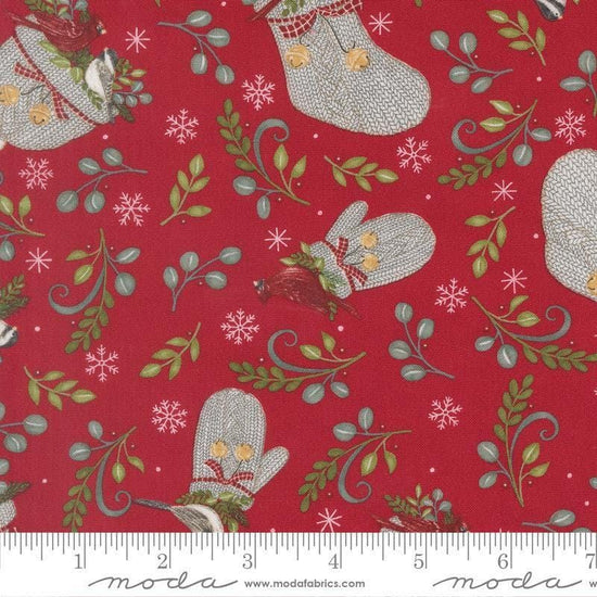 Image of When Snow Falls Winter Wear Berry Red quilting cotton fabric by Deb Strain for Moda Fabrics. Features stockings, mittens, and leaves on a red background. Cute Little Fabric Shop.