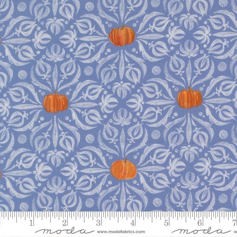 Image of Coven Medallion Tiles Dusk quilting cotton fabric by Robin Pickens for Moda Fabrics. Features pumpkins and swirls on a blue background. Cute Little Fabric Shop.