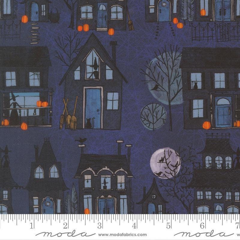 Image of Coven Witch Village Midnight quilting cotton fabric by Robin Pickens for Moda Fabrics. Features haunted houses on a blue background. Cute Little Fabric Shop.