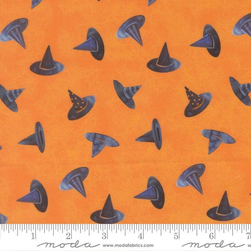 Image of Coven Witch Hats Pumpkin quilting cotton fabric by Robin Pickens for Moda Fabrics. Features hats on an orange background. Cute Little Fabric Shop.