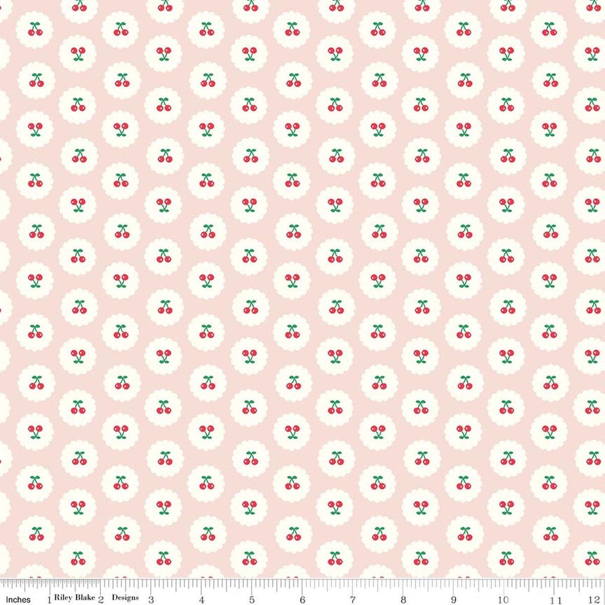 Image of Cotton Nook Cherries Blush quilting cotton fabric by Minki Kim for Riley Blake Designs. Features cherries on a pink background. Cute Little Fabric Shop.