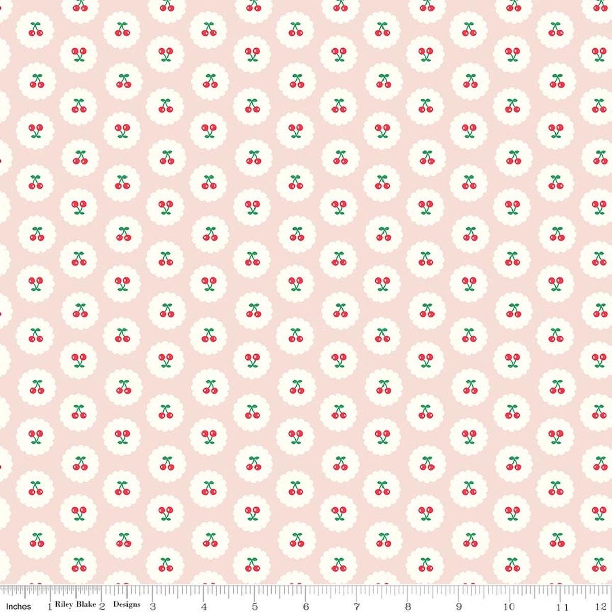Image of Cotton Nook Cherries Blush quilting cotton fabric by Minki Kim for Riley Blake Designs. Features cherries on a pink background. Cute Little Fabric Shop.