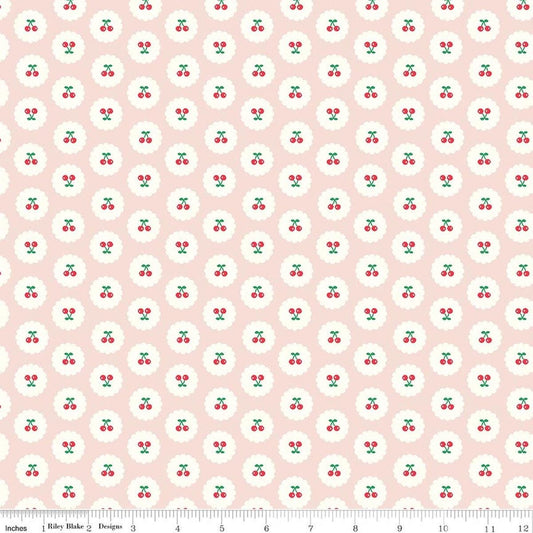 Image of Cotton Nook Cherries Blush quilting cotton fabric by Minki Kim for Riley Blake Designs. Features cherries on a pink background. Cute Little Fabric Shop.
