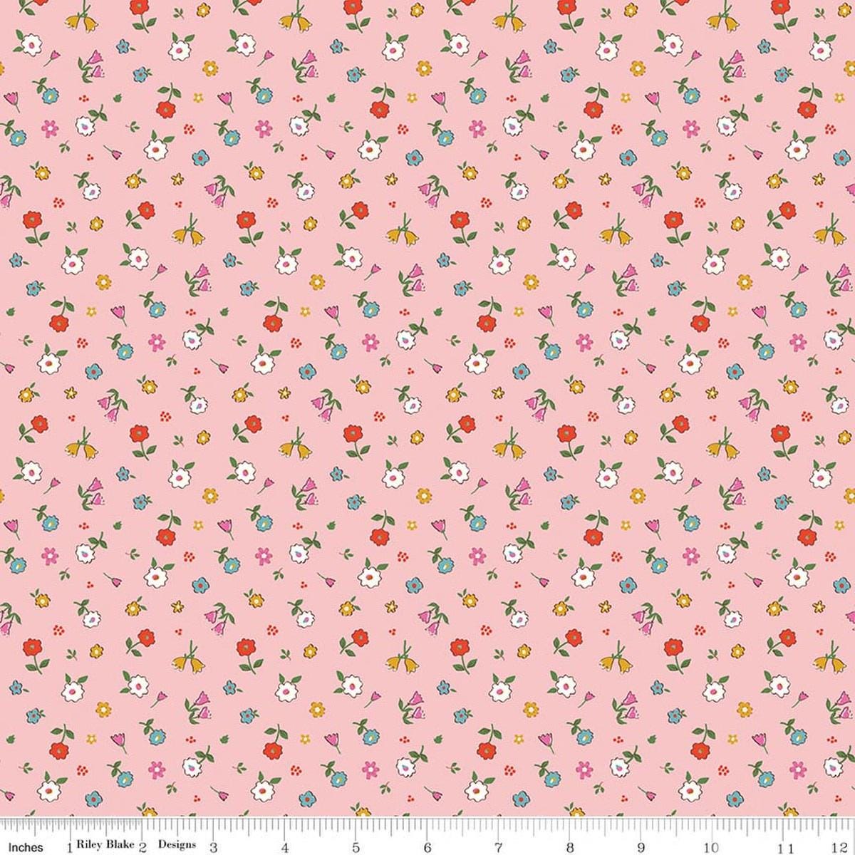 Image of Cotton Nook Pretty Pink quilting cotton fabric by Minki Kim for Riley Blake Designs. Features flowers on a pink background. Cute Little Fabric Shop.