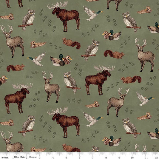 Image of Whispering Pines Animal Toss Green quilting cotton fabric by The RBD Designers for Riley Blake Designs. Features animals on a green background. Cute Little Fabric Shop.
