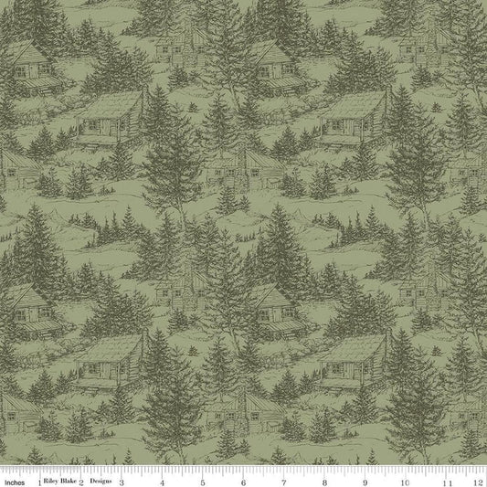 Image of Whispering Pines Cabins Green quilting cotton fabric by The RBD Designers for Riley Blake Designs. Features cabins in trees on a green background. Cute Little Fabric Shop.