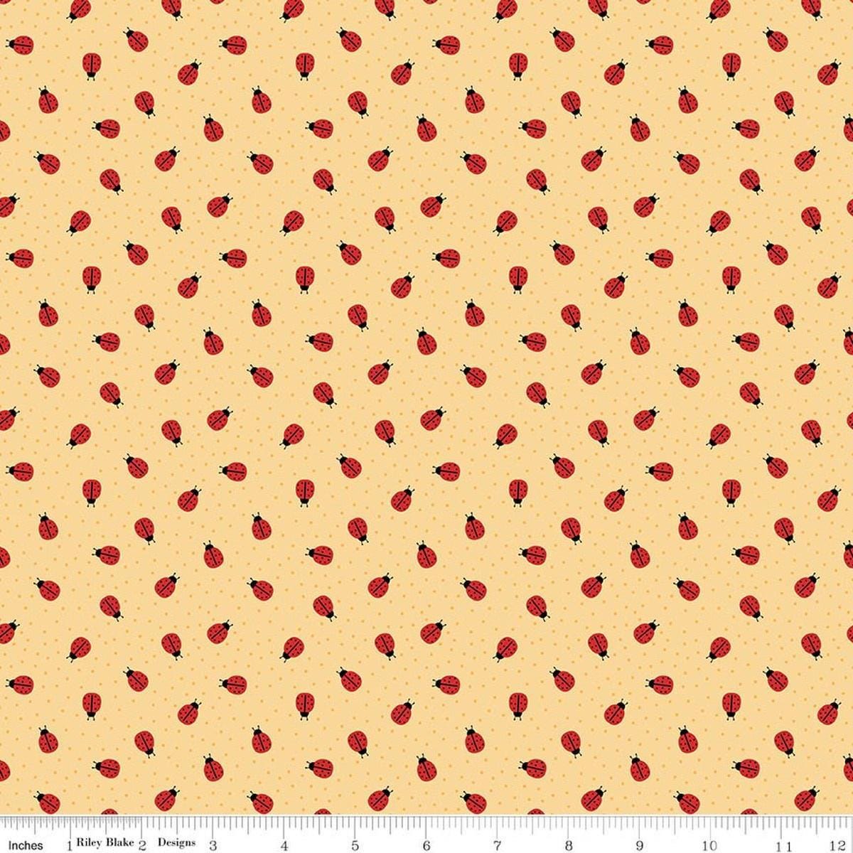 Image of Little Ladybug Ladybugs Yellow quilting cotton fabric by Lori Whitlock for Riley Black Designs. Features ladybugs on a yellow background. Cute Little Fabric Shop.