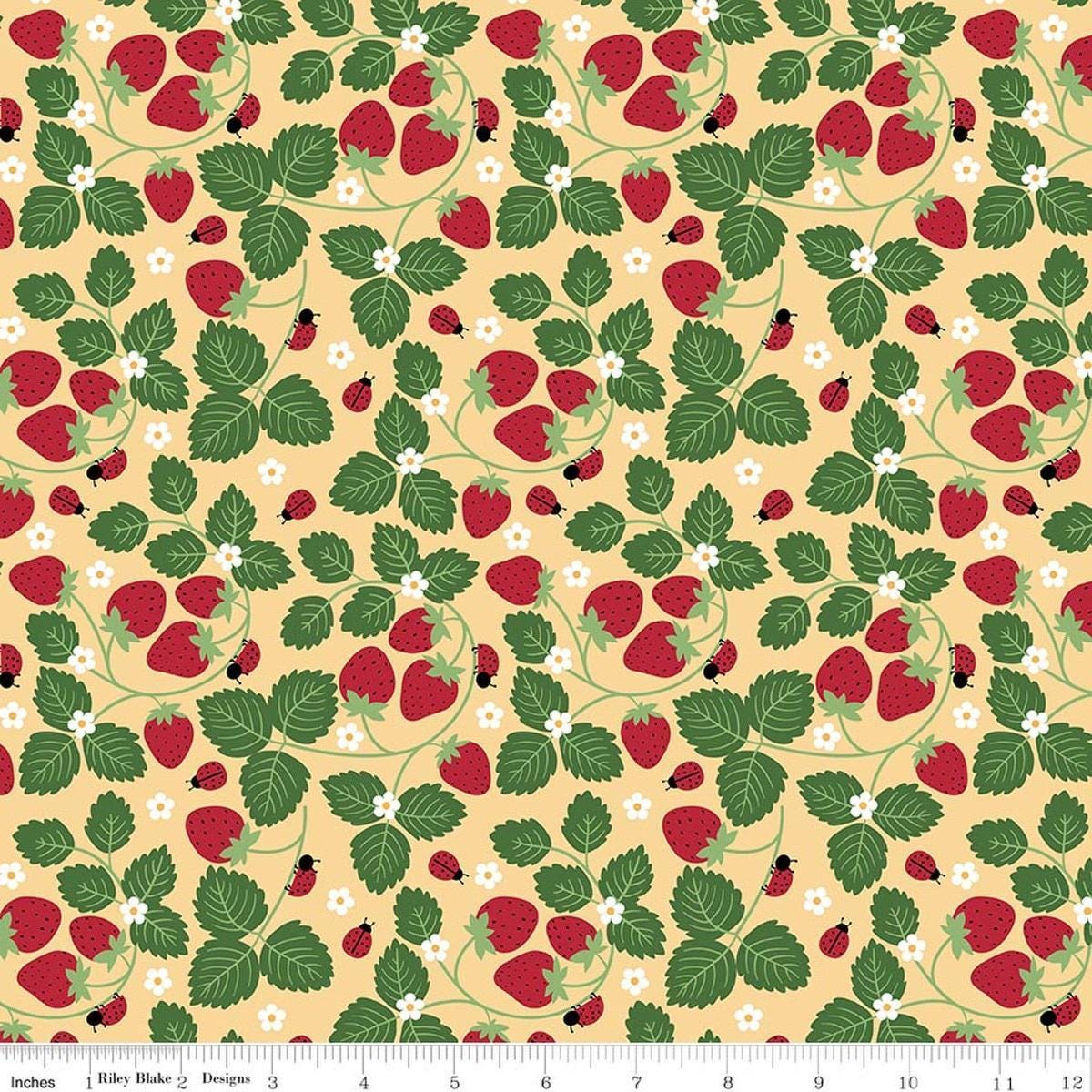 Image of Little Ladybug Strawberries Yellow quilting cotton fabric by Lori Whitlock for Riley Black Designs. Features strawberries and leaves on a yellow background. Cute Little Fabric Shop.