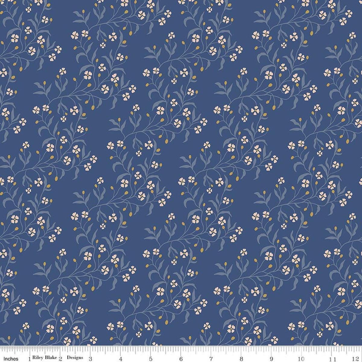 Image of Before the Blooms Astrid Denim quilting cotton fabric by Danelys Sidron for Riley Blake Designs. Features flowers on a blue background. Cute Little Fabric Shop.