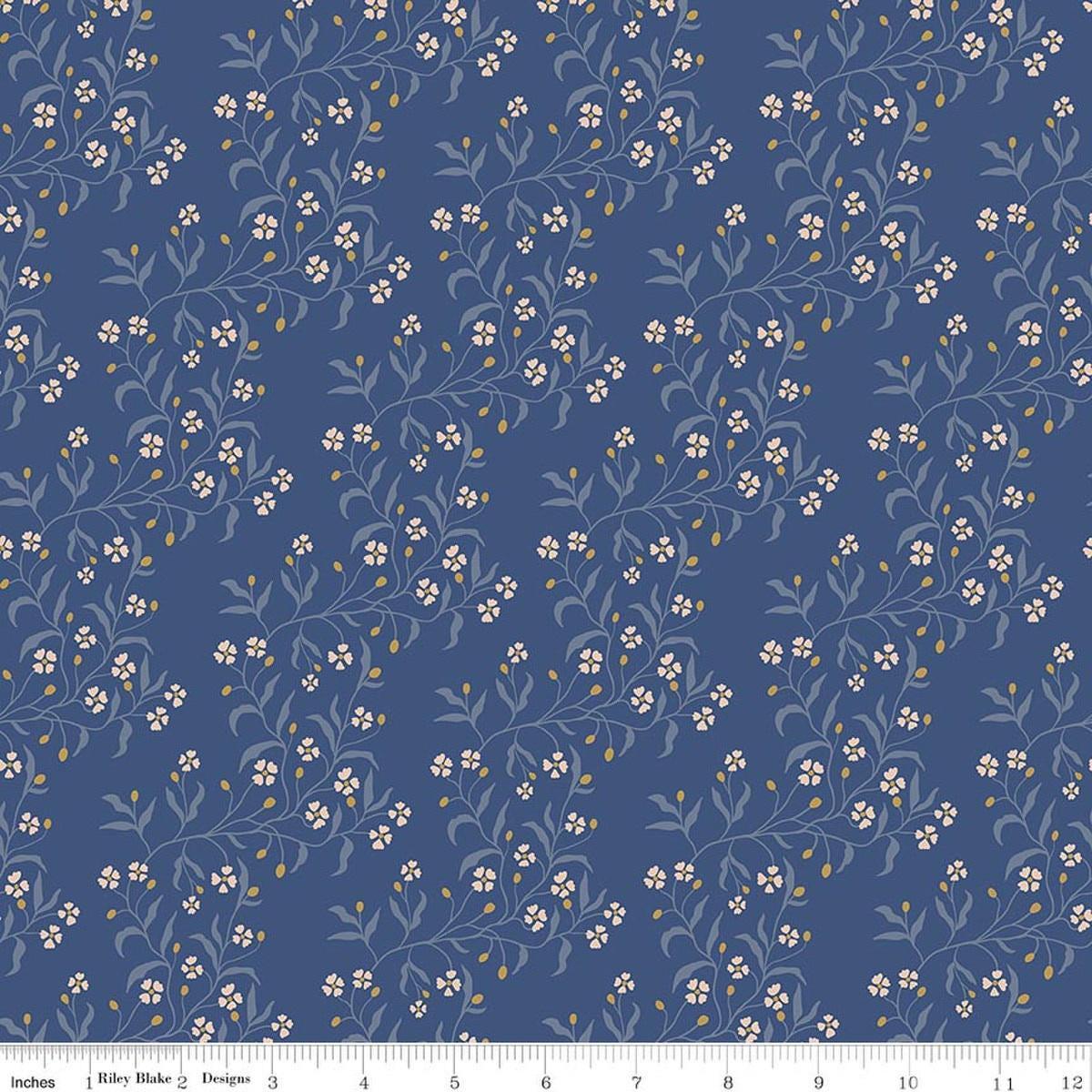 Image of Before the Blooms Astrid Denim quilting cotton fabric by Danelys Sidron for Riley Blake Designs. Features flowers on a blue background. Cute Little Fabric Shop.