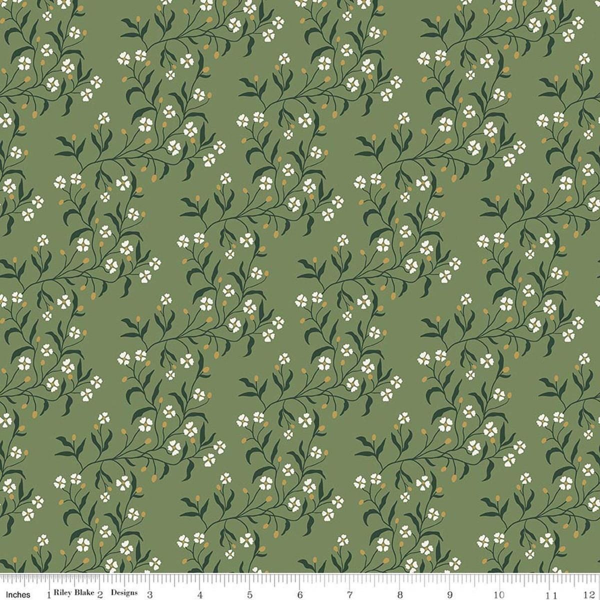 Image of Before the Blooms Astrid Basil quilting cotton fabric by Danelys Sidron for Riley Blake Designs. Features flowers on a green background. Cute Little Fabric Shop.