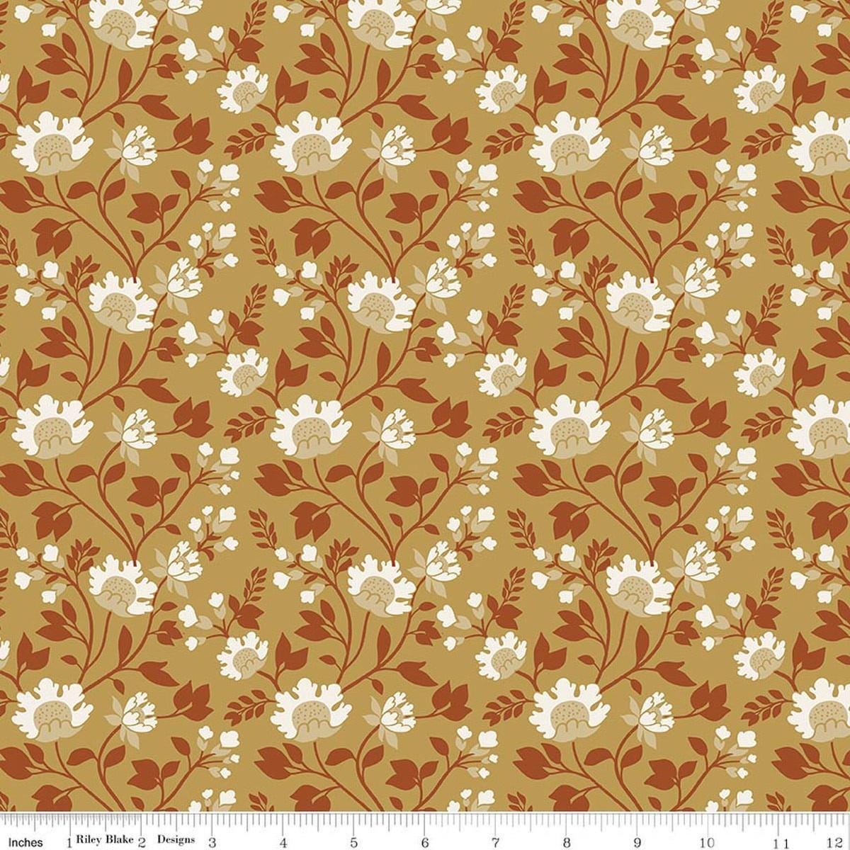 Image of Before the Blooms Florence Gold quilting cotton fabric by Danelys Sidron for Riley Blake Designs. Features flowers on a gold background. Cute Little Fabric Shop.