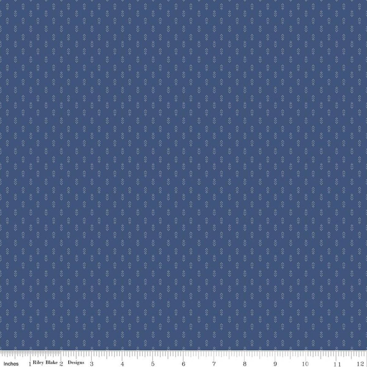 Image of Before the Blooms Mira Denim quilting cotton fabric by Danelys Sidron for Riley Blake Designs. Features flowers on a blue background. Cute Little Fabric Shop.