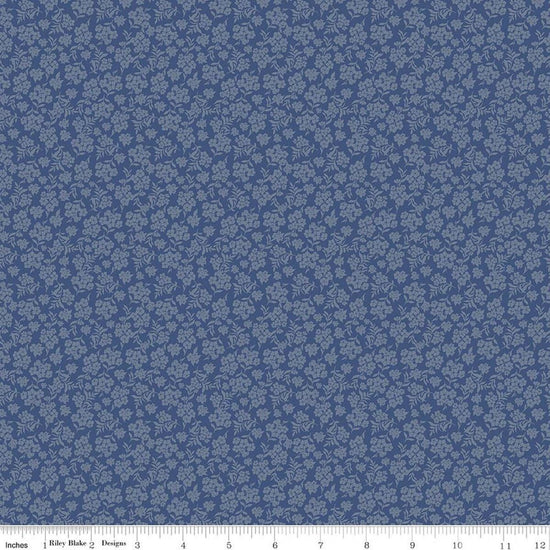 Image of Before the Blooms Viola Denim quilting cotton fabric by Danelys Sidron for Riley Blake Designs. Features flowers on a blue background. Cute Little Fabric Shop.
