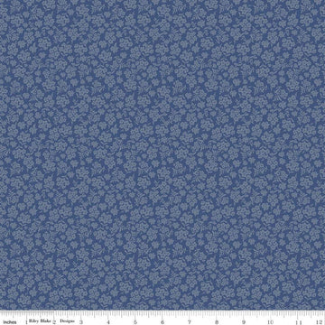 Image of Before the Blooms Viola Denim quilting cotton fabric by Danelys Sidron for Riley Blake Designs. Features flowers on a blue background. Cute Little Fabric Shop.