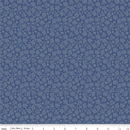 Image of Before the Blooms Viola Denim quilting cotton fabric by Danelys Sidron for Riley Blake Designs. Features flowers on a blue background. Cute Little Fabric Shop.