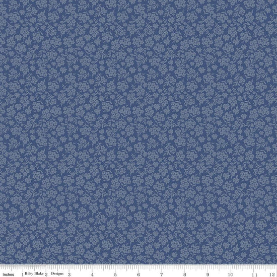 Image of Before the Blooms Viola Denim quilting cotton fabric by Danelys Sidron for Riley Blake Designs. Features flowers on a blue background. Cute Little Fabric Shop.