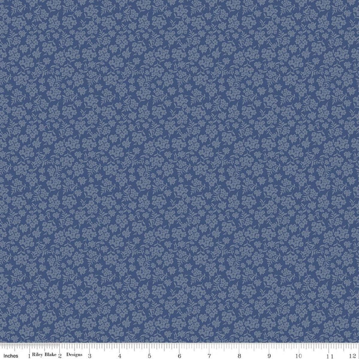 Image of Before the Blooms Viola Denim quilting cotton fabric by Danelys Sidron for Riley Blake Designs. Features flowers on a blue background. Cute Little Fabric Shop.