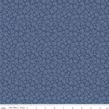 Image of Before the Blooms Viola Denim quilting cotton fabric by Danelys Sidron for Riley Blake Designs. Features flowers on a blue background. Cute Little Fabric Shop.