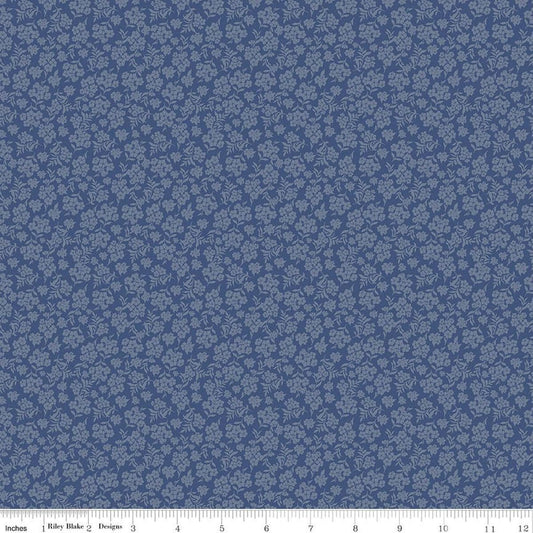 Image of Before the Blooms Viola Denim quilting cotton fabric by Danelys Sidron for Riley Blake Designs. Features flowers on a blue background. Cute Little Fabric Shop.
