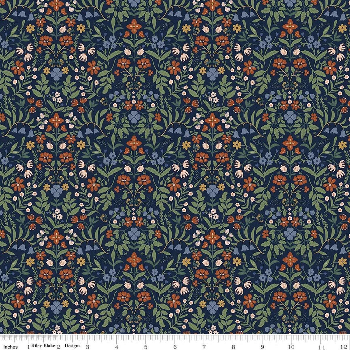 Image of Before the Blooms Iris Indigo quilting cotton fabric by Danelys Sidron for Riley Blake Designs. Features flowers on a blue background. Cute Little Fabric Shop.