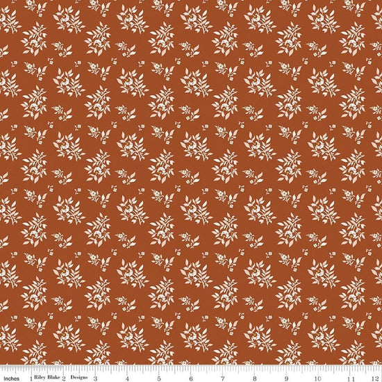 Image of Before the Blooms Juniper Rust quilting cotton fabric by Danelys Sidron for Riley Blake Designs. Features flowers on an orange background. Cute Little Fabric Shop.