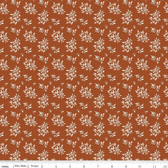 Image of Before the Blooms Juniper Rust quilting cotton fabric by Danelys Sidron for Riley Blake Designs. Features flowers on an orange background. Cute Little Fabric Shop.