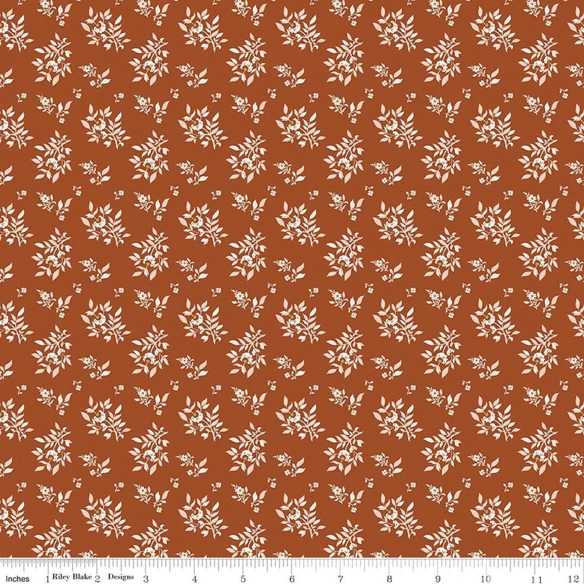 Image of Before the Blooms Juniper Rust quilting cotton fabric by Danelys Sidron for Riley Blake Designs. Features flowers on an orange background. Cute Little Fabric Shop.