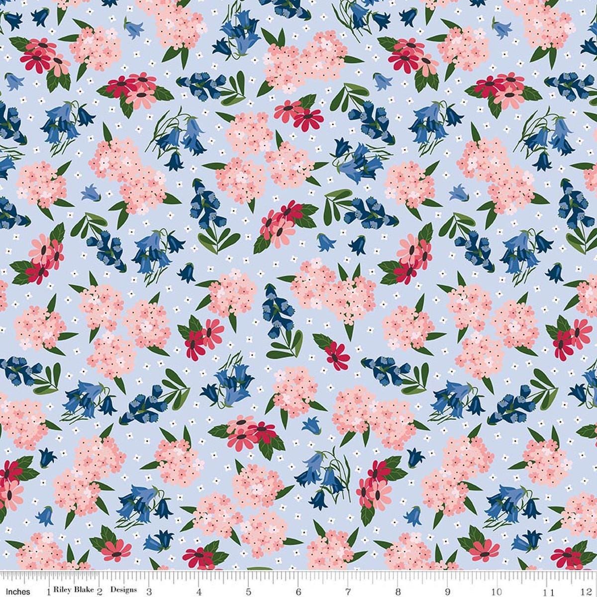 Image of Foxglove Main Blue quilting cotton fabric by Jill Finley for Riley Blake Designs. Features flowers on a blue background. Cute Little Fabric Shop.