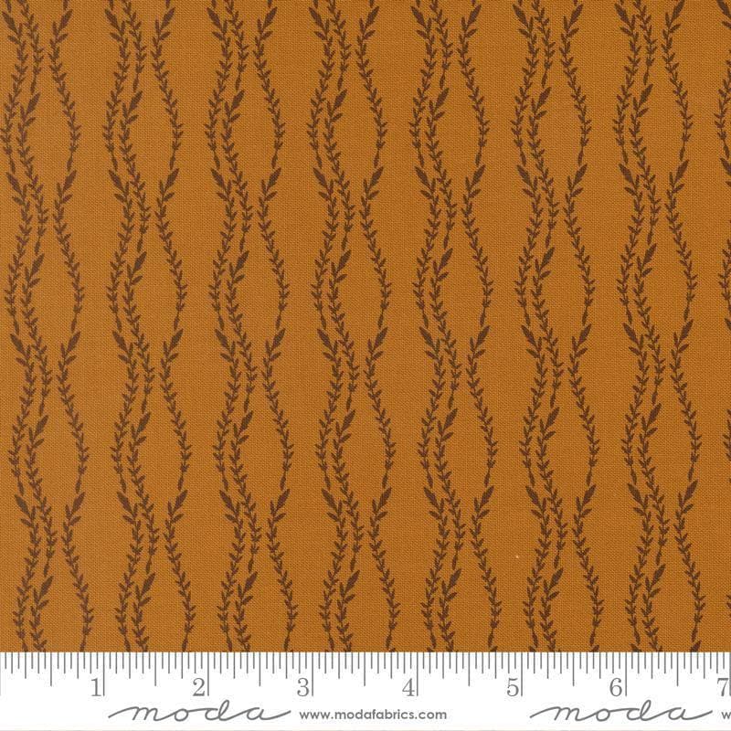 Image of Windfall Vine Stripe Caramel quilting cotton fabric by Fancy That Design House for Moda Fabric. Features vines on a brown background. Cute Little Fabric Shop.