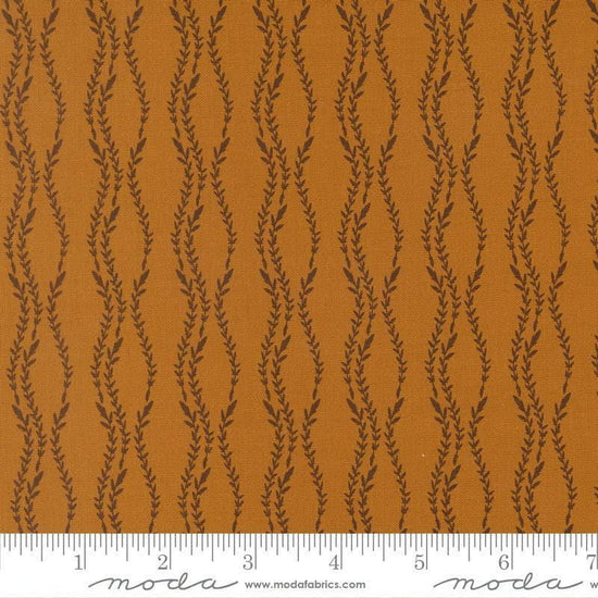 Image of Windfall Vine Stripe Caramel quilting cotton fabric by Fancy That Design House for Moda Fabric. Features vines on a brown background. Cute Little Fabric Shop.