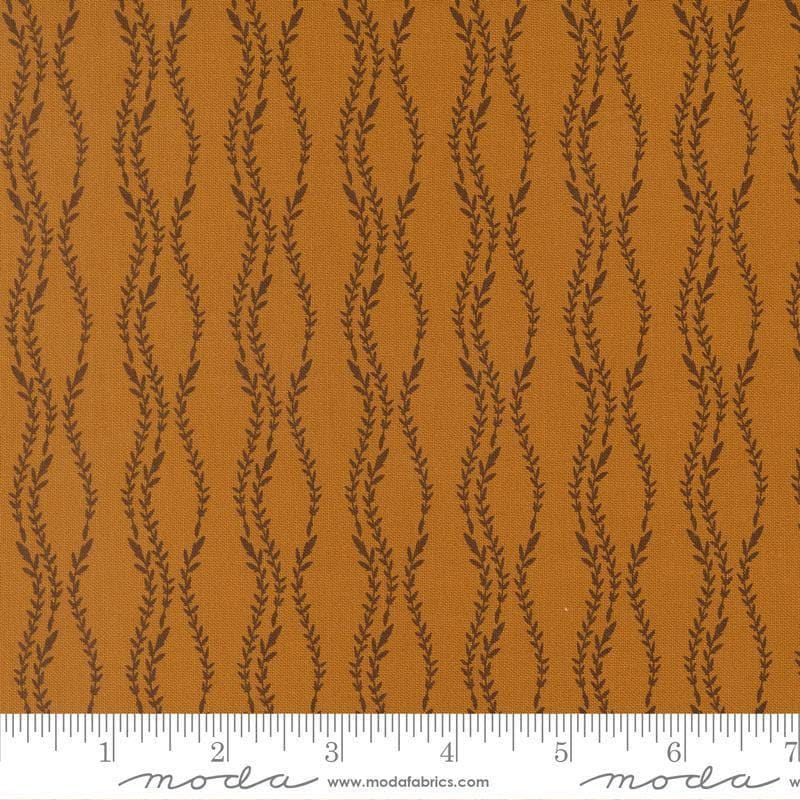 Image of Windfall Vine Stripe Caramel quilting cotton fabric by Fancy That Design House for Moda Fabric. Features vines on a brown background. Cute Little Fabric Shop.